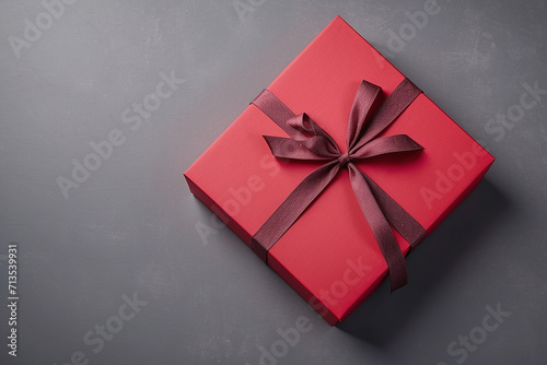red gift box on the grey paper background