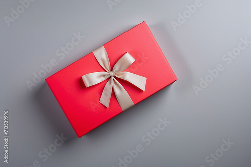 red gift box on the grey paper background 