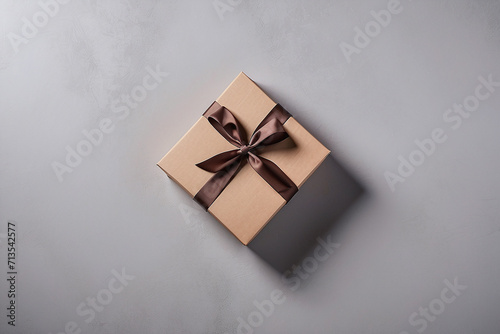 brown gift box on the grey paper background