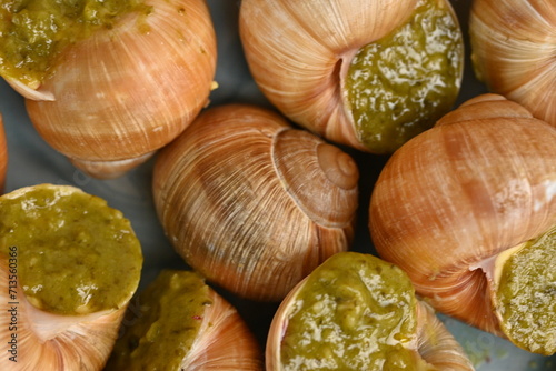 macro snails with pesto sauce photo above, snails with basil pesto, Grana Padano and pine nuts