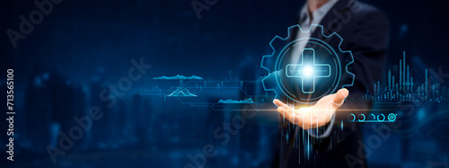Healthcare. Businessman Holding Icon with Medical Innovations, Patient Care on Analysis Chart and Networking