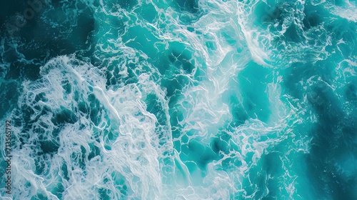 Above aerial view of turquoise ocean water with splashes