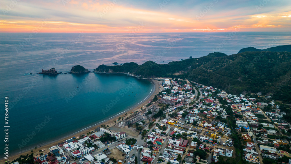 Barra de Navidad Aerial of Jalisco town beach resort destination in Mexico drone fly at sunset scenic seascape