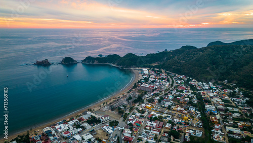 Barra de Navidad Aerial of Jalisco town beach resort destination in Mexico drone fly at sunset scenic seascape