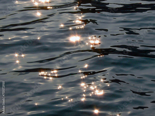 Water surface in the Venice lagoon with light reflections.