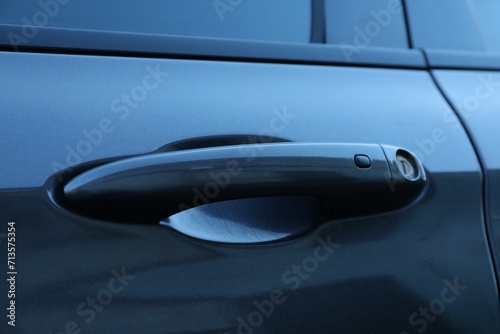 Closeup view of car door with handle