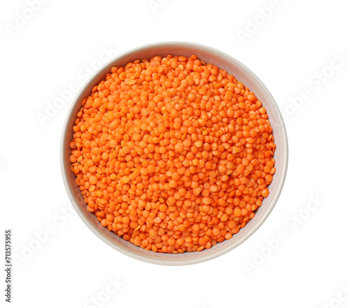 Raw red lentils in bowl isolated on white, top view