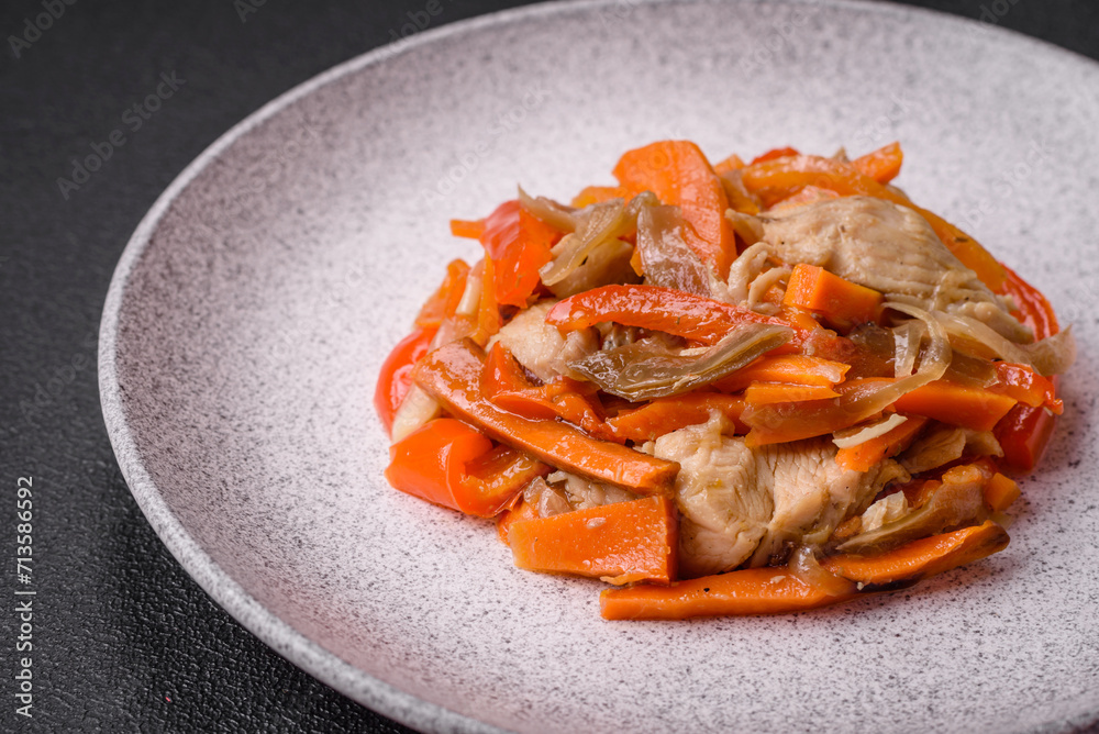 Delicious fresh stew with chicken or turkey with slices of sweet pepper and carrots Delicious fresh stew with chicken or turkey with slices of sweet pepper and carrots