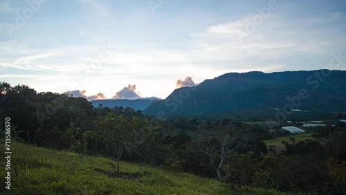 Timelapse of the sunset with mountains trees and clouds day to night 4K 30fps