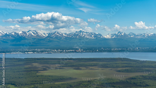 Aerial view of Anchorage, Alaska from the Point MacKenzie area. Joint Base Elmendorf - Richardson, downtown, midtown, Knik Arm, and Chugach mountains.  photo