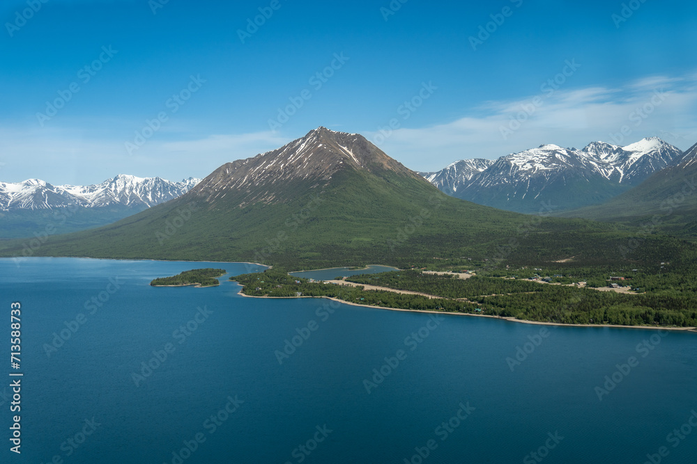 Aerial view of Port Alsworth, Alaska within Lake Clark National Park and Preserve. Private Port Alsworth Airport, public Wilder Natwick Airport, Tanalian Mountain, Chig­mit Mountains, Hardenburg bay.