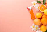 Cleaning product on peach background with citrus fruits and flowers, house cleaning detergent, house cleaning concept