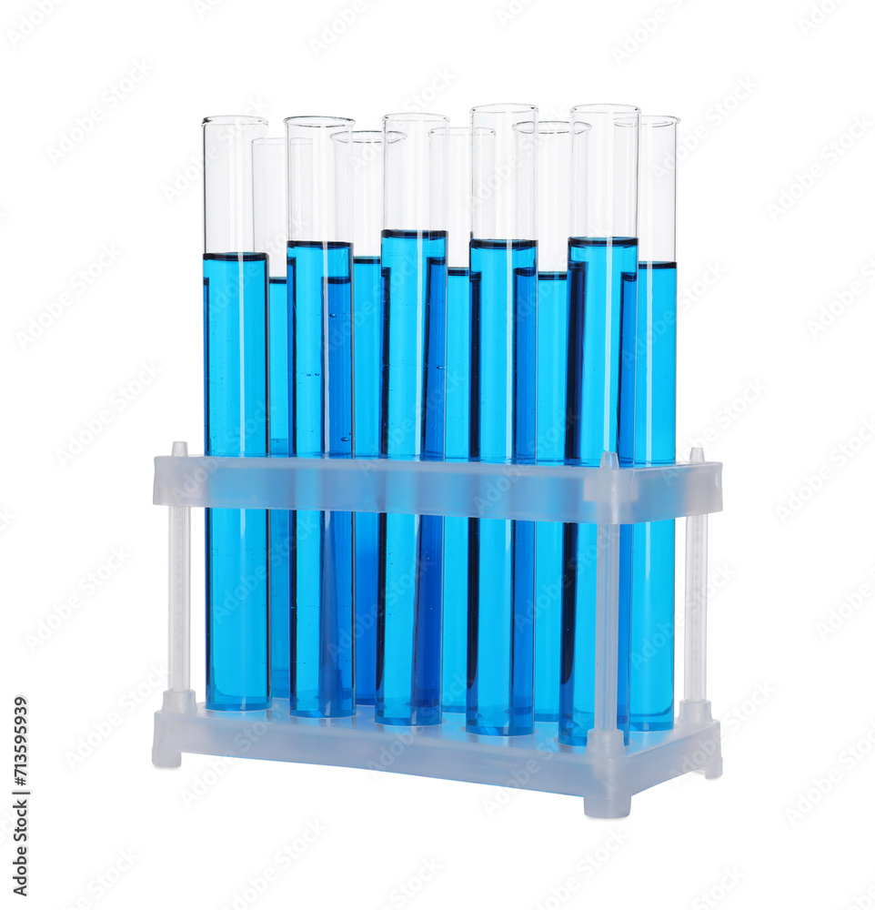 Many test tubes with light blue liquid in stand isolated on white Many test tubes with light blue liquid in stand isolated on white