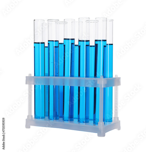 Many test tubes with light blue liquid in stand isolated on white © New Africa