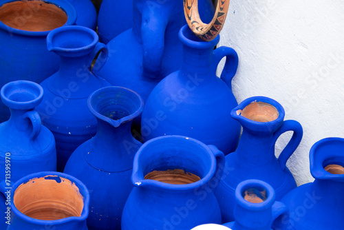 Puesto de artesanía en la medina de Asilah, jarrones cerámicos en color azul intenso típico de las ciudades costeras de marruecos. photo