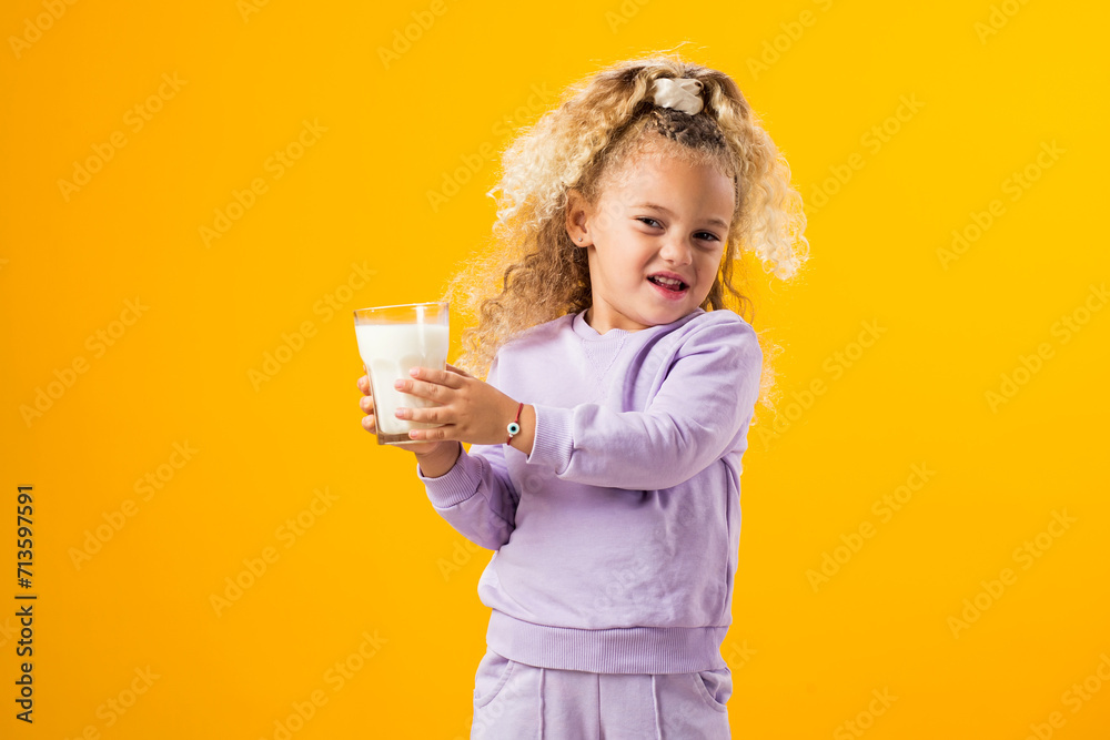Young Girl Expressing Dislike with a Glass of Milk . Illustrating