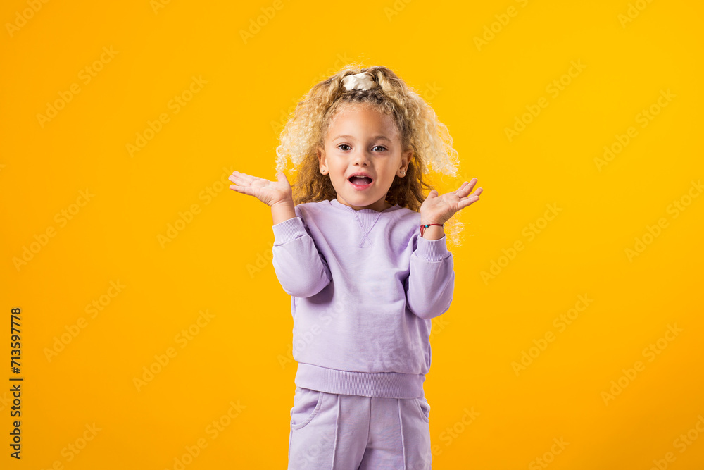 Surprised child girl, eyes wide open, expressing genuine amazement and delight. Surprised child girl, eyes wide open, expressing genuine amazement and delight.