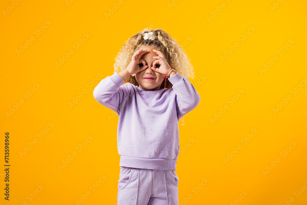 Stressed child girl holding her head. Negative emotions concept