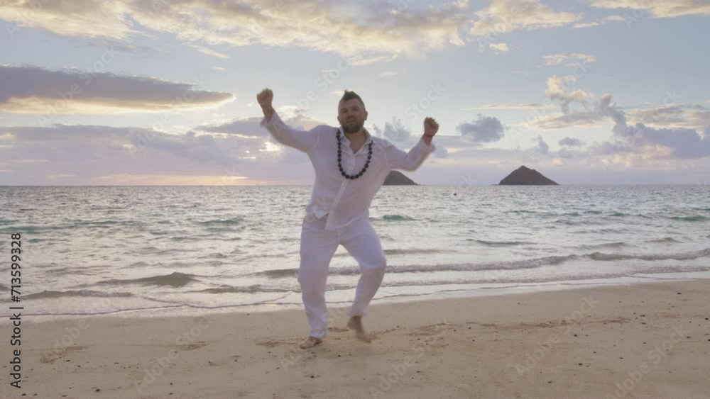 Funny dancing man feeling full freedom on island beach. Happy carefree handsome man in white relaxed clothes rhythmically waving arms crazy about wedding day. Happiness, freedom, laugh, love concept Funny dancing man feeling full freedom on island beach. Happy carefree handsome man in white relaxed clothes rhythmically waving arms crazy about wedding day. Happiness, freedom, laugh, love concept