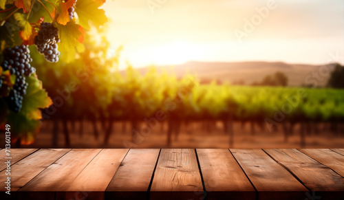 Empty wooden table with sunny vineyard background photo