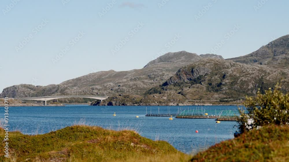 Mountainous Backdrop With Bridge And Fish Farms Mountainous Backdrop With Bridge And Fish Farms