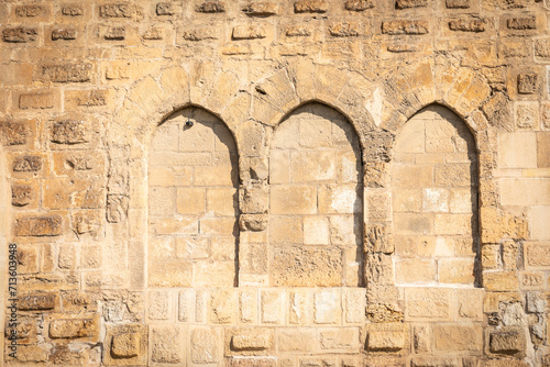 detail of closed arches at the wall of the Episcopal Palace in Tortosa, comarca of Baix Ebre, Province of Tarragona, Catalonia, Spain photo
