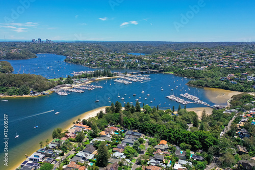 Obraz na płótnie High angle aerial drone view of Spit Bridge, Clontarf Beach and Sandy Bay in the suburb of Clontarf, Sydney, New South Wales, Australia. Northern Beaches area of Sydney and Chatswood in background w salonie