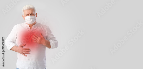 Senior man in medical mask ...