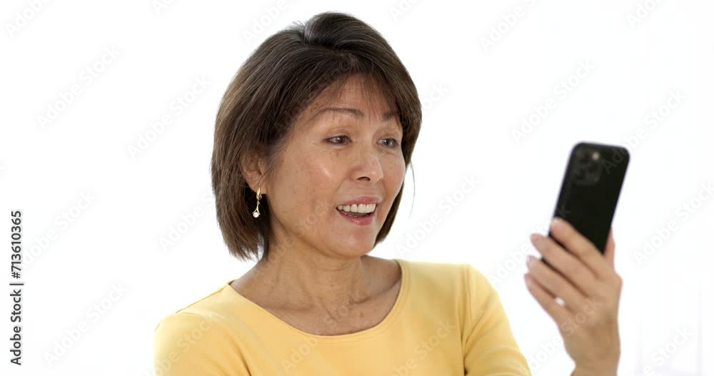 Closeup happy attractive woman smiling enjoying looking at mobile phone laughing talking using face time video chat. Closeup happy attractive woman smiling enjoying looking at mobile phone laughing talking using face time video chat.
