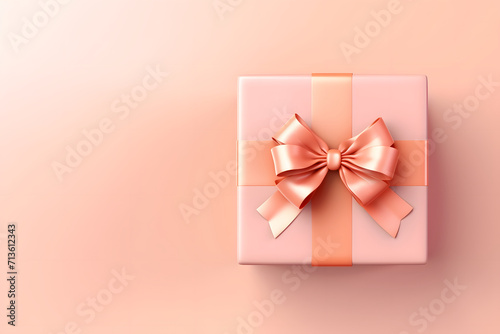 Pink and peach gift box with ribbon and bow on a white background. © Svitlana Sylenko