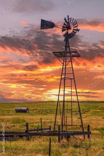 A working windmill and an abandoned prairie shack on the Pawnee National Grasslands in north western Colorado