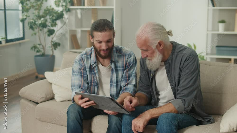 Young volunteer teaches senior how to use a tablet, bridging generation gap, tech-savvy youth, elderly learning, digital literacy, cross-age friendship, modern gadgets