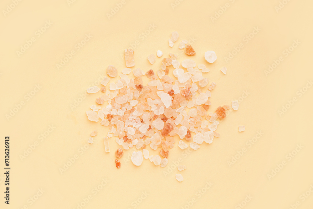 Himalayan pink salt on orange background Himalayan pink salt on orange background