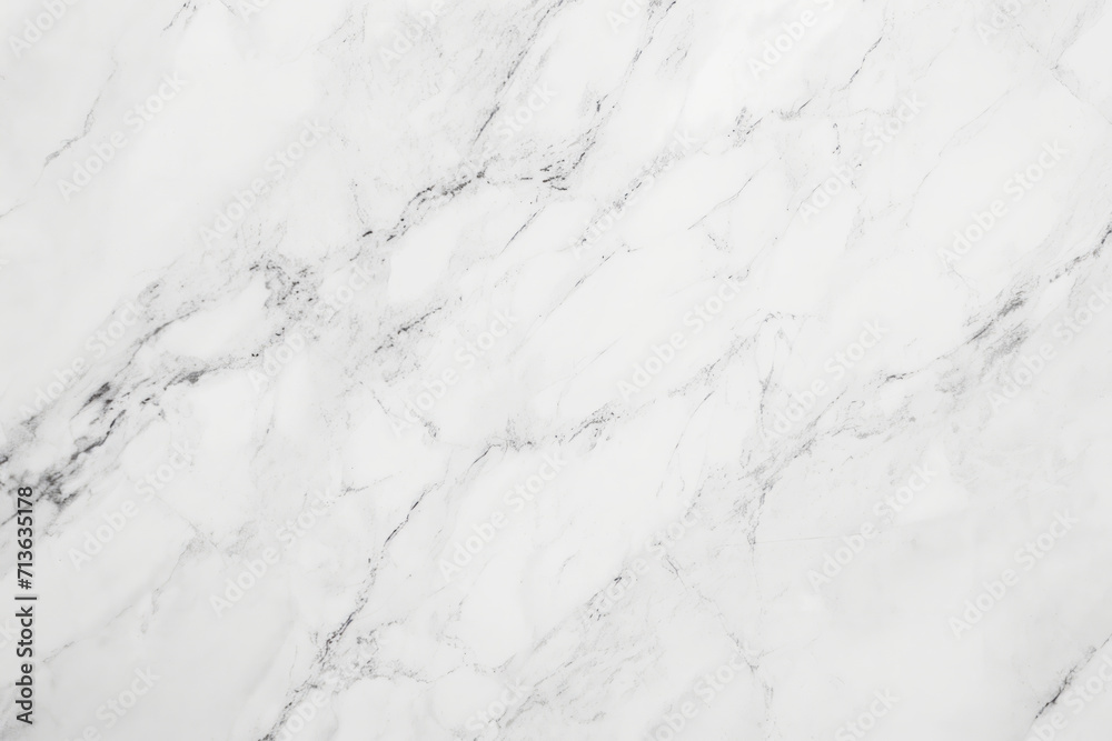 A white marble surface with subtle and intricate grey veins creating a beautiful natural pattern.