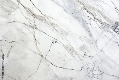 Elegant white marble texture with subtle grey veining, ideal for backgrounds or design elements.