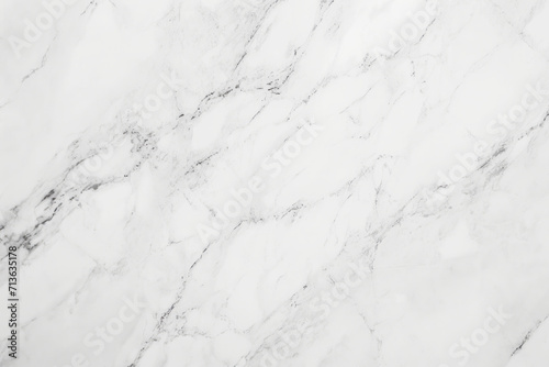 A white marble surface with subtle and intricate grey veins creating a beautiful natural pattern.