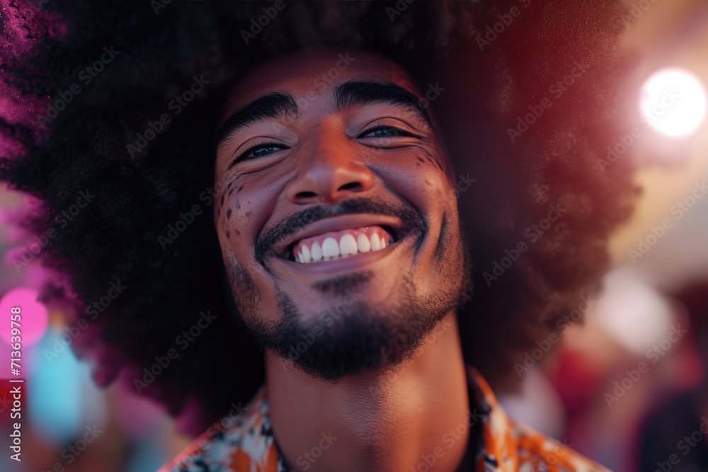 A man with an afro and a beard is smiling A man with an afro and a beard is smiling