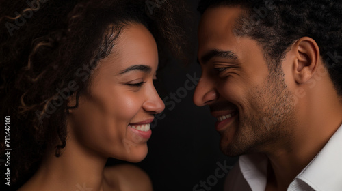 closeup shot of young african american black couple on black wallpaper, valentines day concept, sidepose