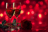 two glasses of wine and rose on the red background