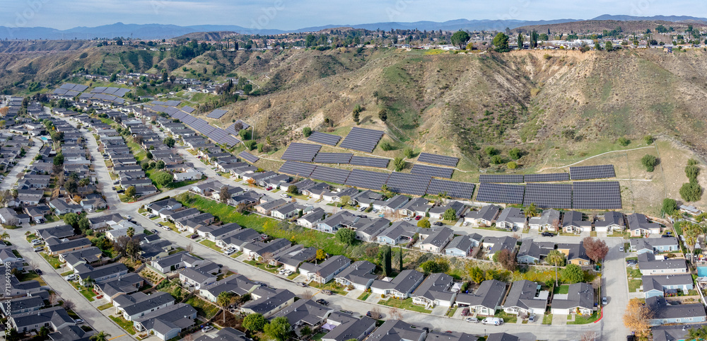 Solar Panels mounted on the hillside in a community of new homes
