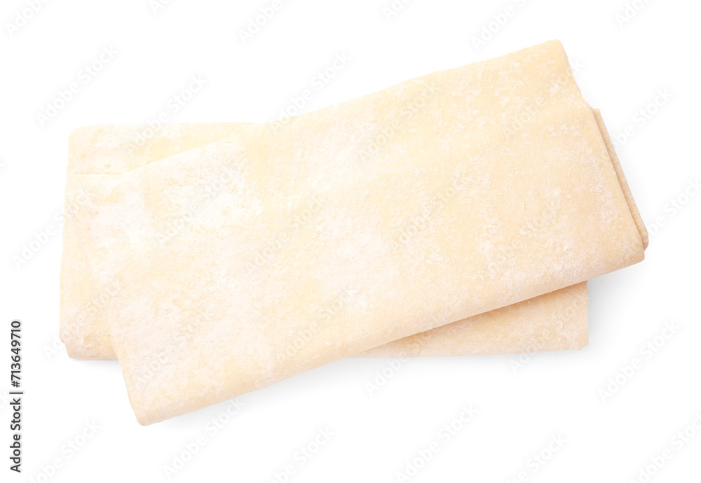 Fototapeta premium Raw puff pastry dough isolated on white, top view