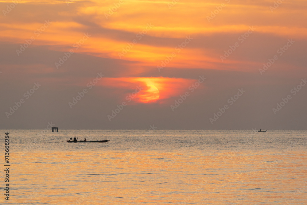 Beautiful sunrise in the sea and orange sky at Phuket city Beautiful sunrise in the sea and orange sky at Phuket city