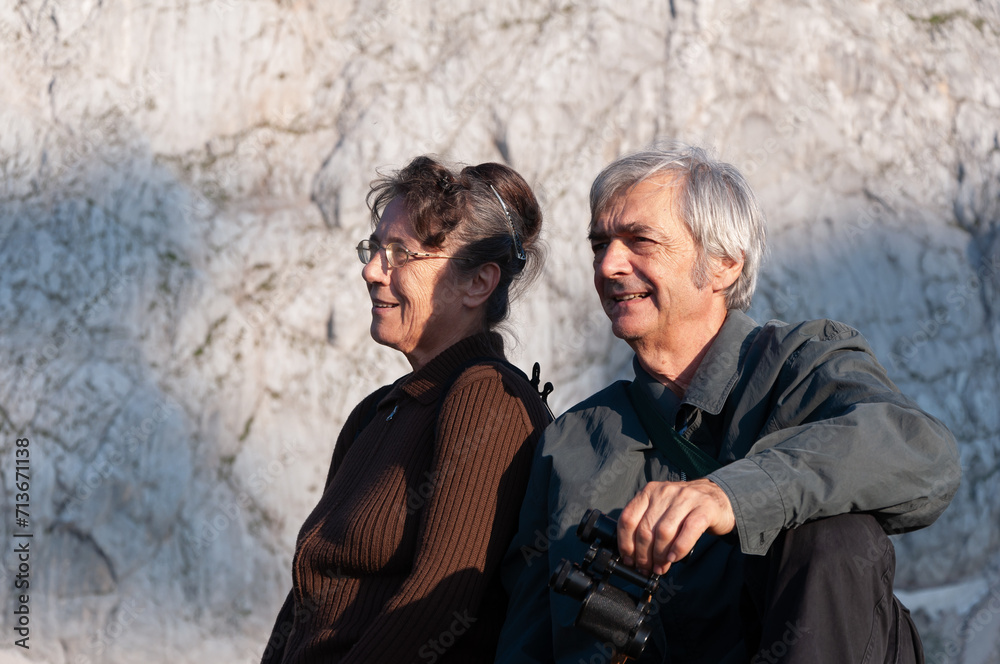 Senior Caucasian Couple Relaxing and Enjoying the View in Mountains Outdoors Portrait