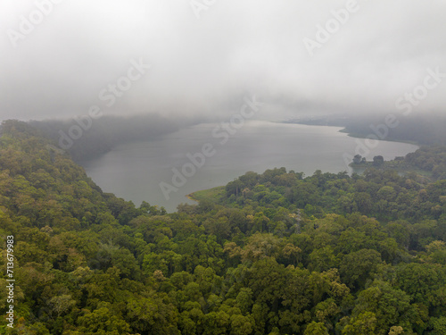 Buyan Lake encompassed by dense forest  in fog and clouds  Bali  Indonesia