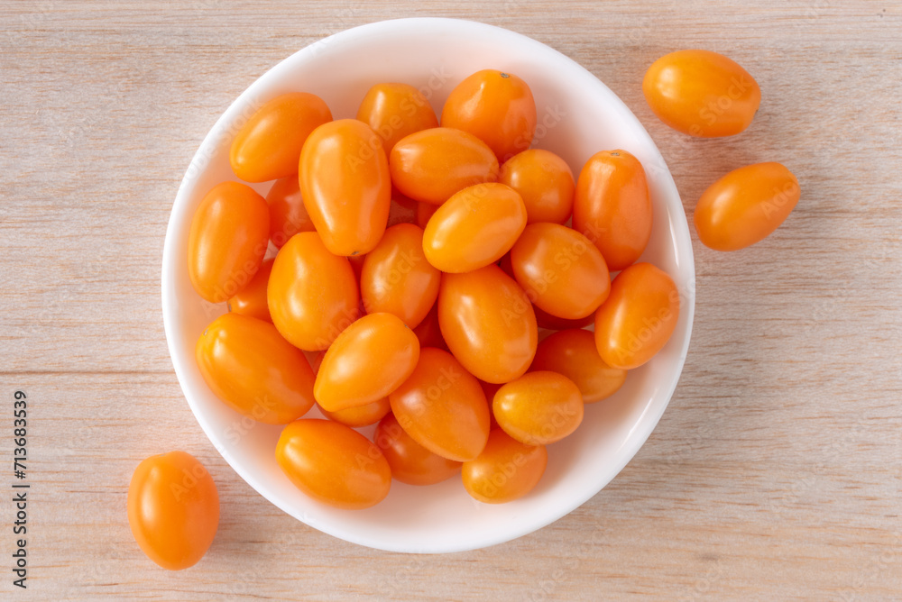 Orange Grape Tomatoes in a Bowl Orange Grape Tomatoes in a Bowl