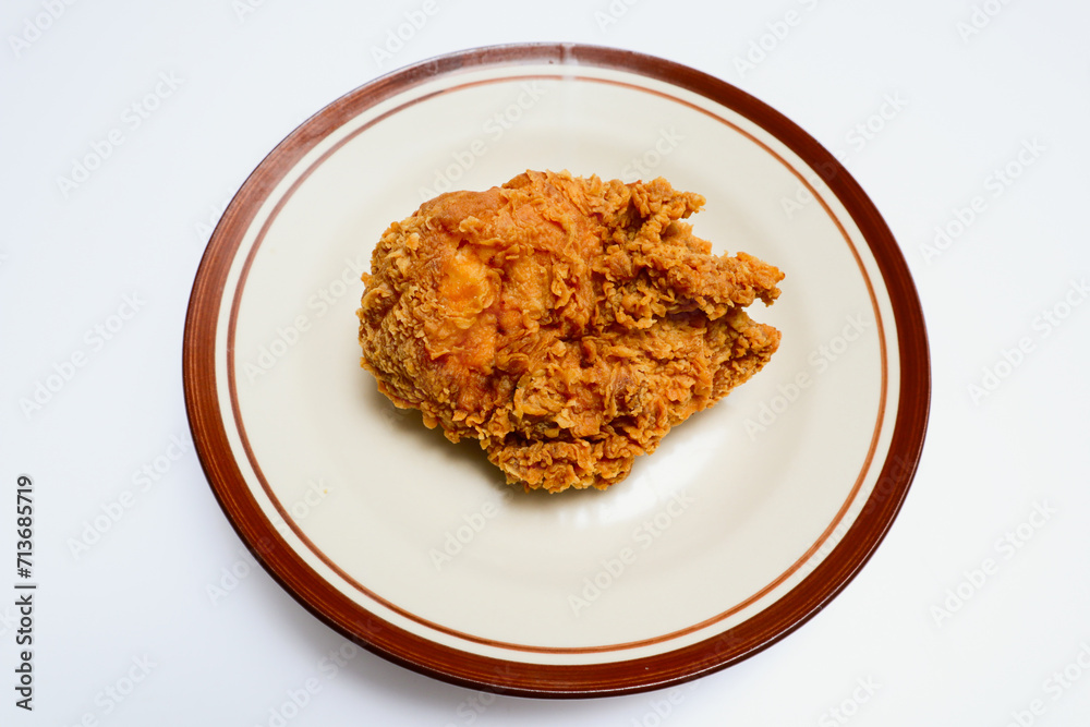 fried chicken on a plate, isolated over white background fried chicken on a plate, isolated over white background