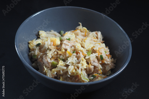 hot fried rice in a bowl on table 
