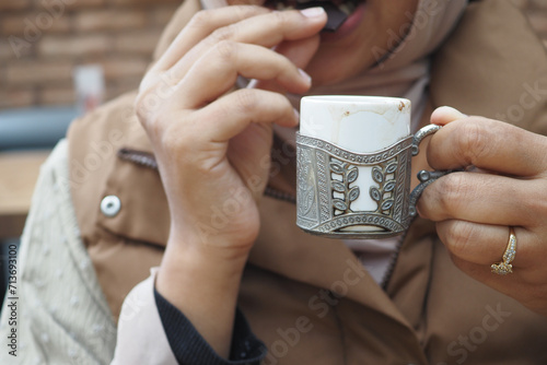  women drinking turkish coffee at cafe  photo