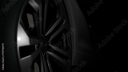 Detail on one of car rim modern car on black background,copy space © Wahyu