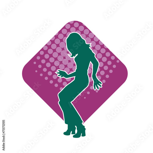 Silhouette of a female dancer in action pose. Silhouette of a woman dancing happily.